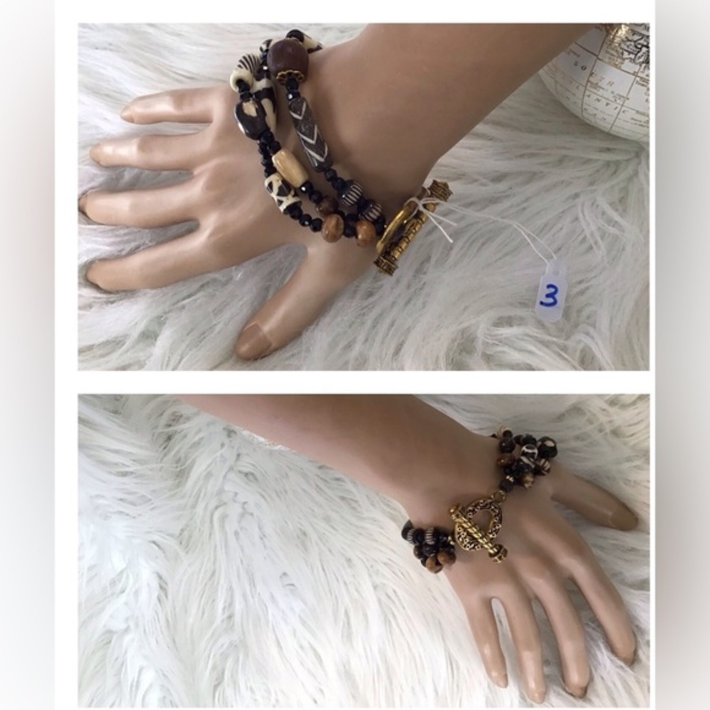 3 strands African bracelet w/glass, wood & bone beads. Vintage clasp. Size 9 1/2